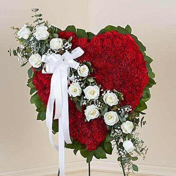 Heart-shaped red floral standing spray with white roses and ribbon