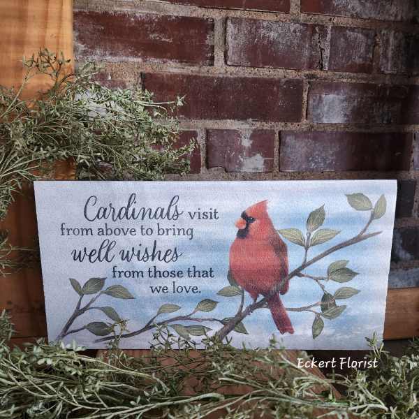 Decorative sign with a cardinal and a well-wishes message