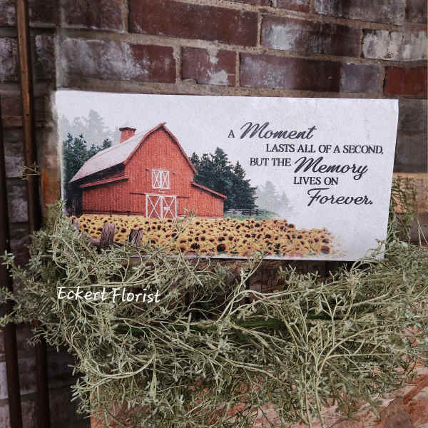 Sympathy card with a barn and sunflower field on a brick wall