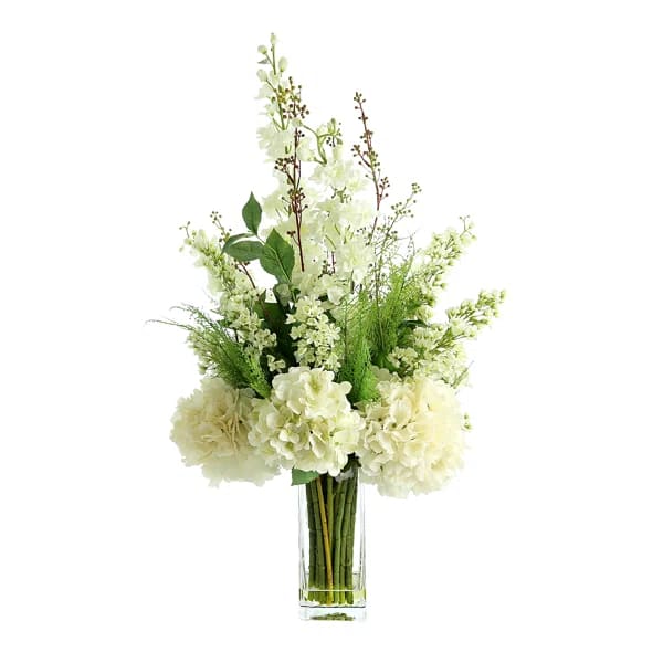 White floral arrangement in a clear glass vase