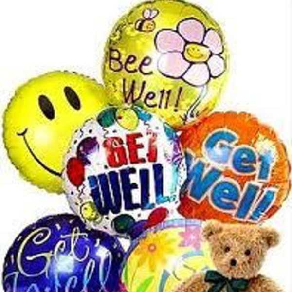 Cluster of colorful balloons with a teddy bear and cheerful messages