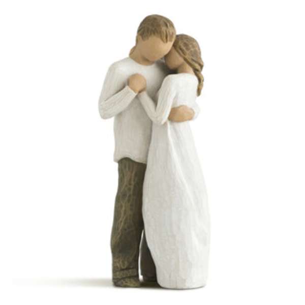 Wooden figurine of a couple embracing