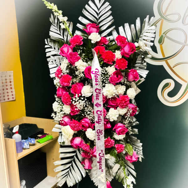 Standing floral spray with pink and white roses and carnations