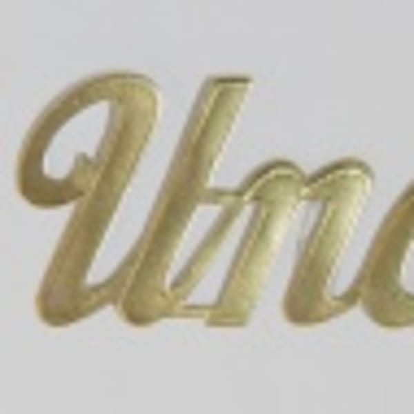 Gold script reading "Uncle" on a white background
