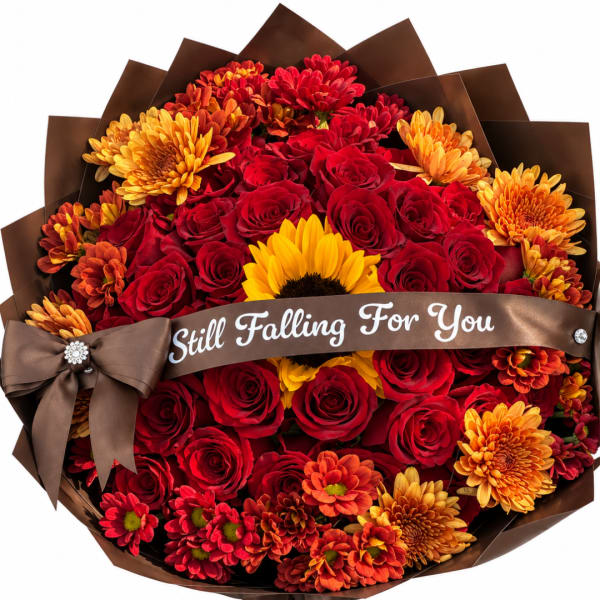 Bouquet of red roses and orange chrysanthemums with a brown ribbon