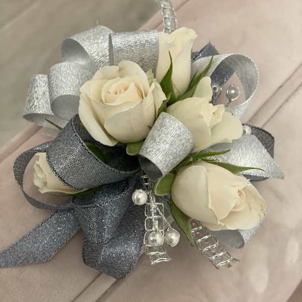 Cream rose corsage with silver ribbon and pearl accents