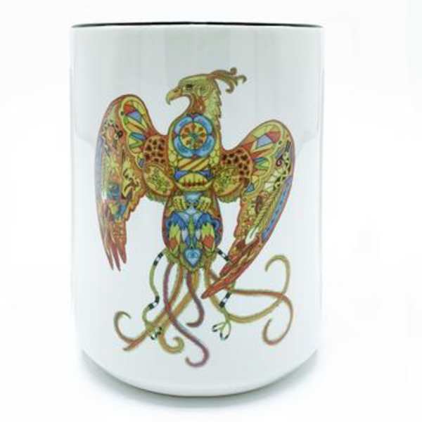 White ceramic mug with a colorful bird illustration