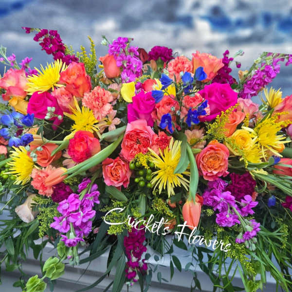 Bright mixed bouquet with roses, carnations, and yellow daisies