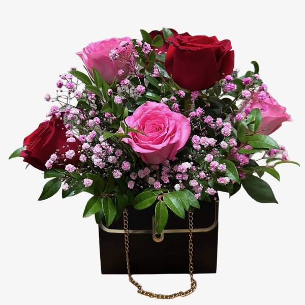 Bouquet of red and pink roses in a black gift box