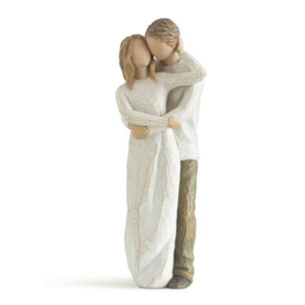 Wooden figurine of a couple embracing