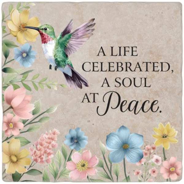 Sympathy plaque with a hummingbird and pastel flowers around the text