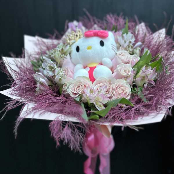 Pink rose bouquet with a Hello Kitty plush in the center