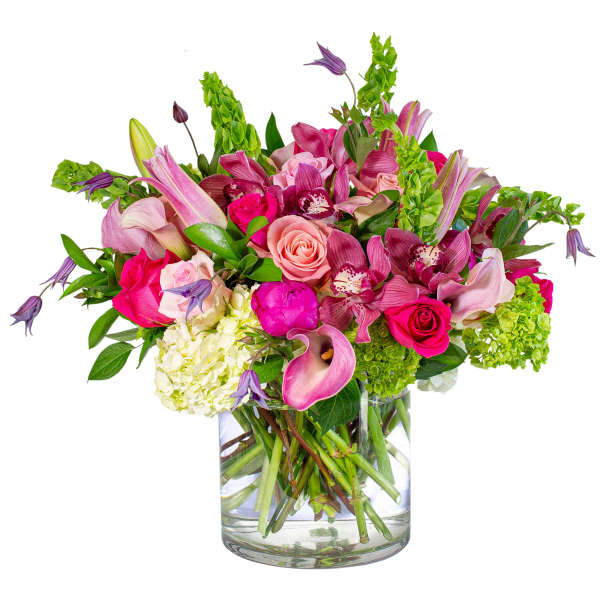 Pink and purple mixed bouquet in a clear glass vase