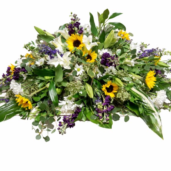 Large mixed floral spray with sunflowers, white lilies, and purple blooms