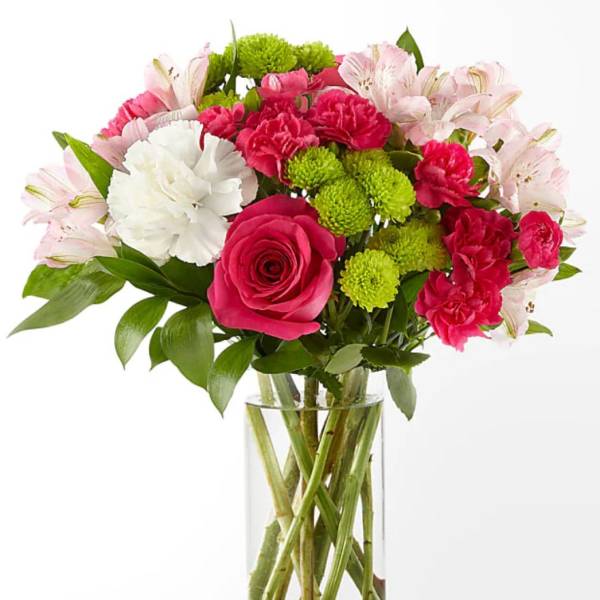 Bouquet of pink and white flowers in a clear glass vase