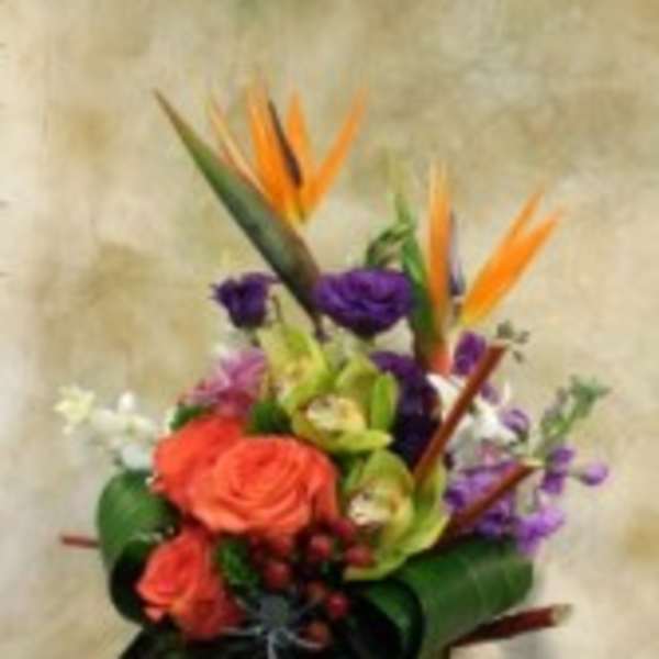Tropical bouquet with orange bird-of-paradise and purple flowers