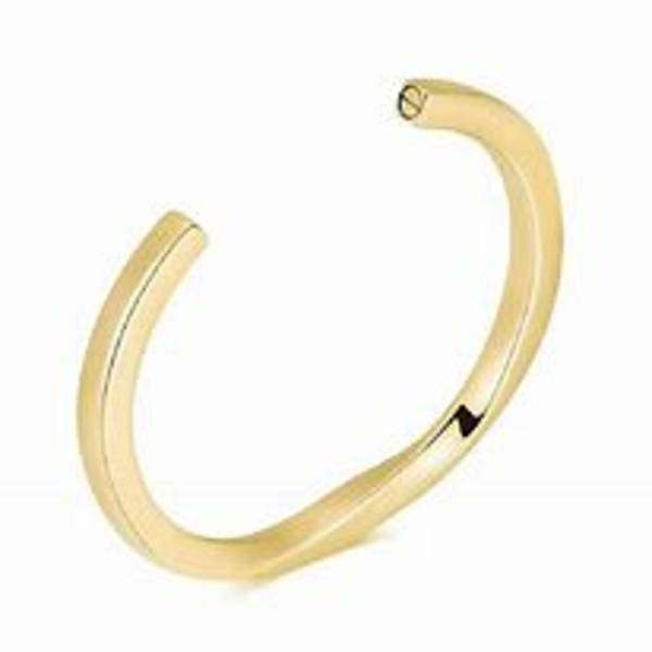 Gold-toned open cuff bracelet on a white background