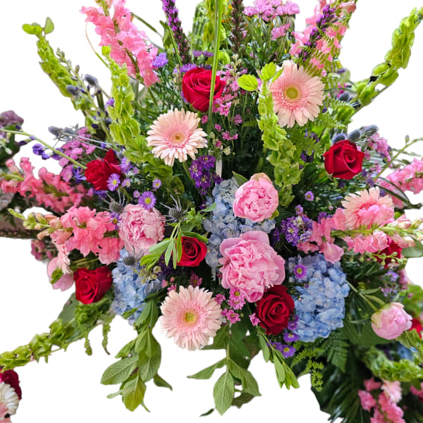 Large mixed bouquet with pink, red, blue, and purple flowers