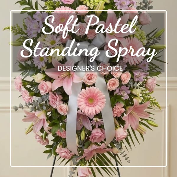 Pink and white standing spray with a ribbon bow