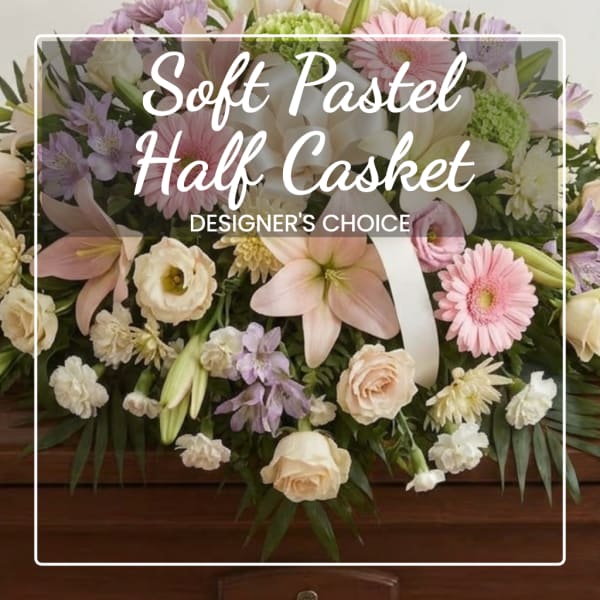 Pastel casket spray with lilies, roses, and daisies