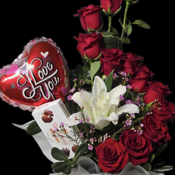 Red roses and white lilies in a gift box with a heart balloon