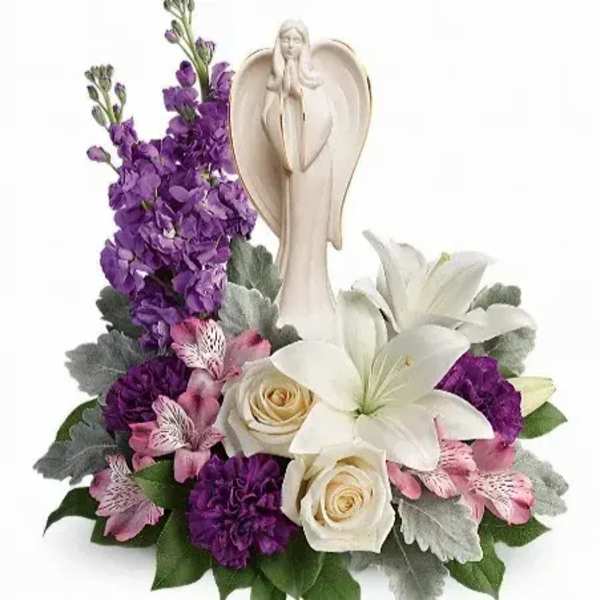White angel figurine with purple and white flowers