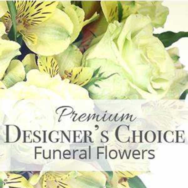Yellow and white funeral flower arrangement with lilies and alstroemeria