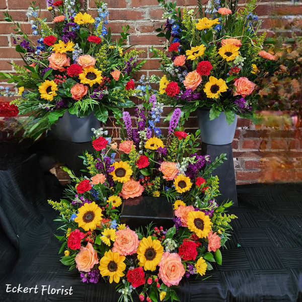 Eckert Florist's Bright Memorial Urn Arrangement (Photo Represents Premium Upgrade) *Our Local Delivery Only