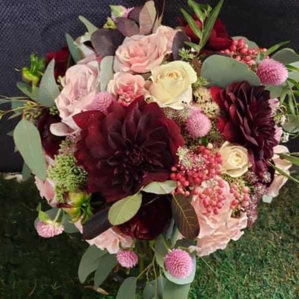 Bouquet of burgundy, blush, and cream flowers with eucalyptus