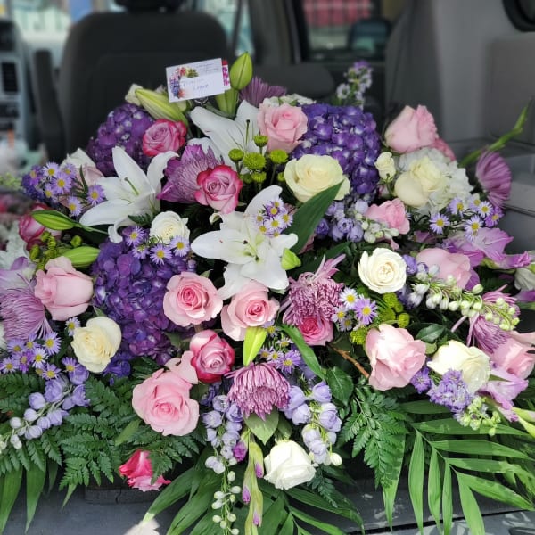 Large mixed bouquet of pink, white, and purple flowers