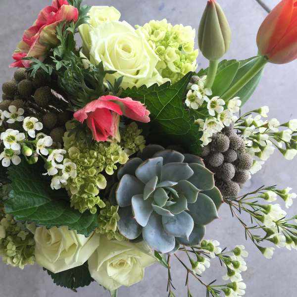 Bouquet with white roses, pink tulips, and a succulent accent