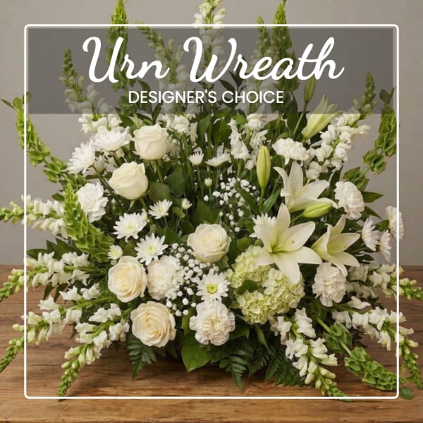 White floral wreath with roses, lilies, and snapdragons