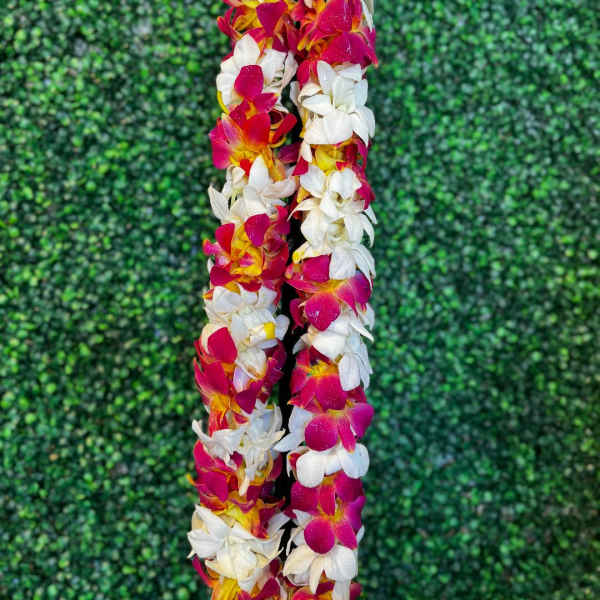 Two flower leis with pink, white, and yellow blossoms