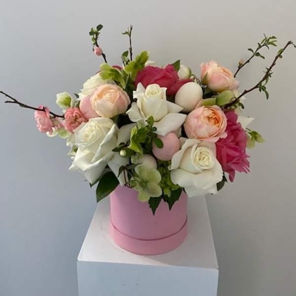 Pink and white rose arrangement in a pink hat box