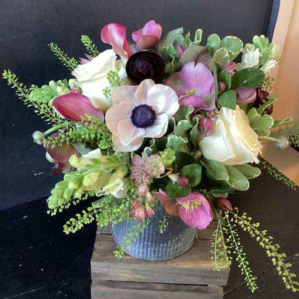 Bouquet of pink and white flowers in a metal vase