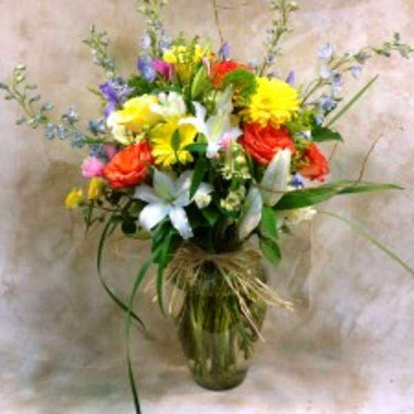 Colorful mixed flower bouquet in a glass vase