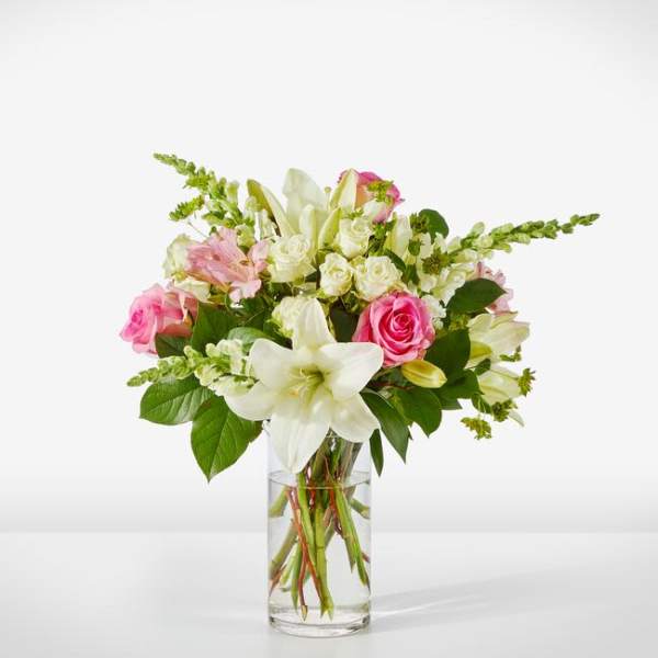 Pink and white mixed bouquet in a clear glass vase