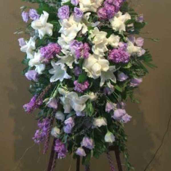 Tall standing floral spray with white and lavender flowers