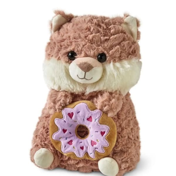 Plush teddy bear holding a donut-shaped toy