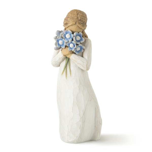 Figurine of a girl holding a bouquet of blue flowers