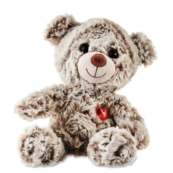 Plush teddy bear with a red heart on its chest