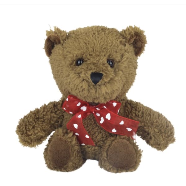 Brown teddy bear with a red heart-pattern ribbon