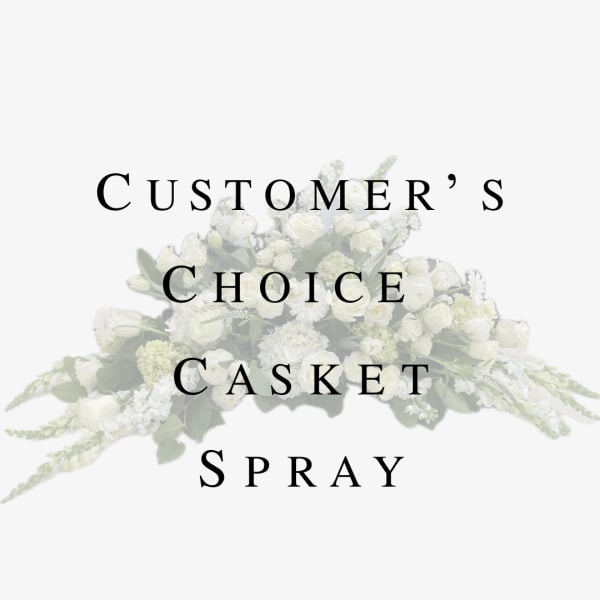 White casket spray with mixed flowers and greenery