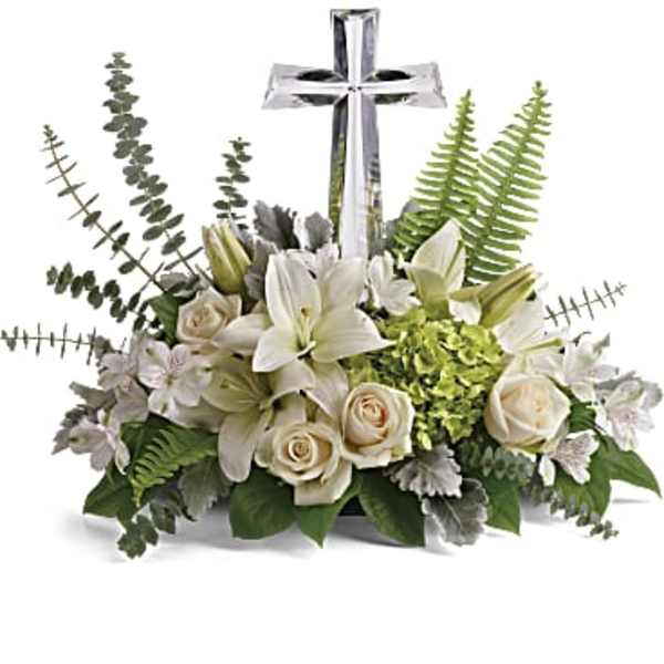 White floral arrangement with a silver cross centerpiece