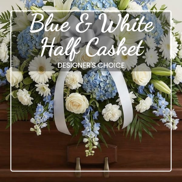 Blue and white half casket spray with roses, lilies, hydrangeas, and daisies