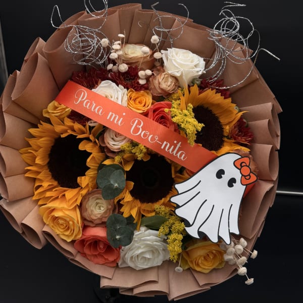 Bouquet of sunflowers and roses with a ghost decoration and ribbon