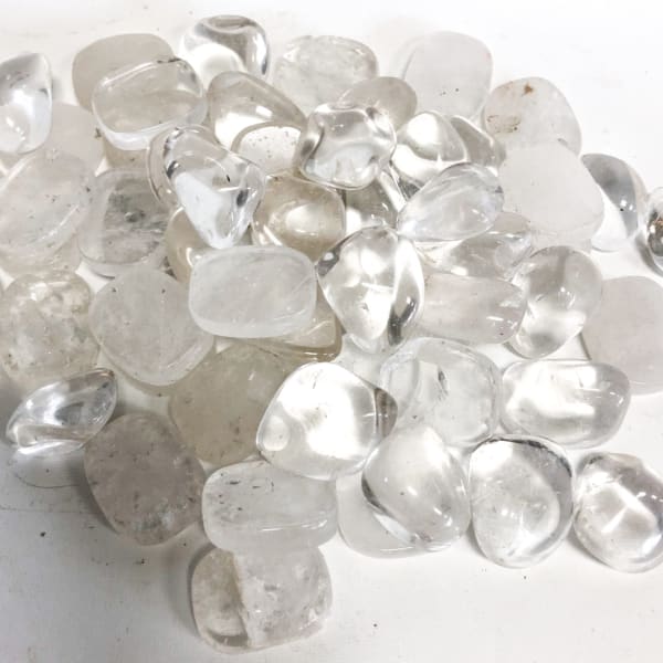 Pile of clear polished stones on a white surface