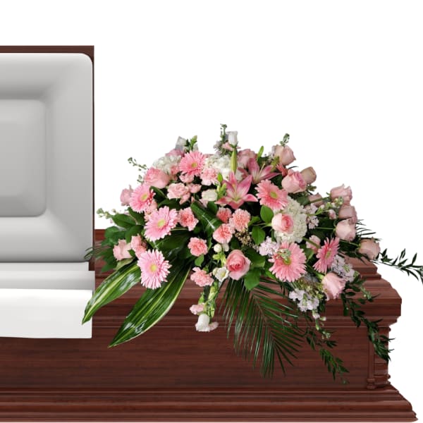 Pink floral casket spray with roses and daisies