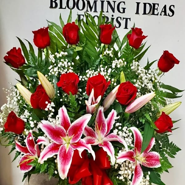 Large bouquet of red roses and pink stargazer lilies with baby's breath