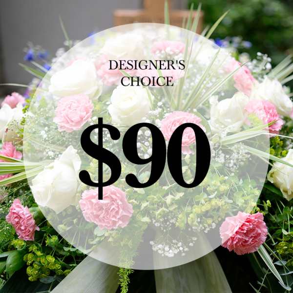 Pink and white floral arrangement with a $90 designer's choice label